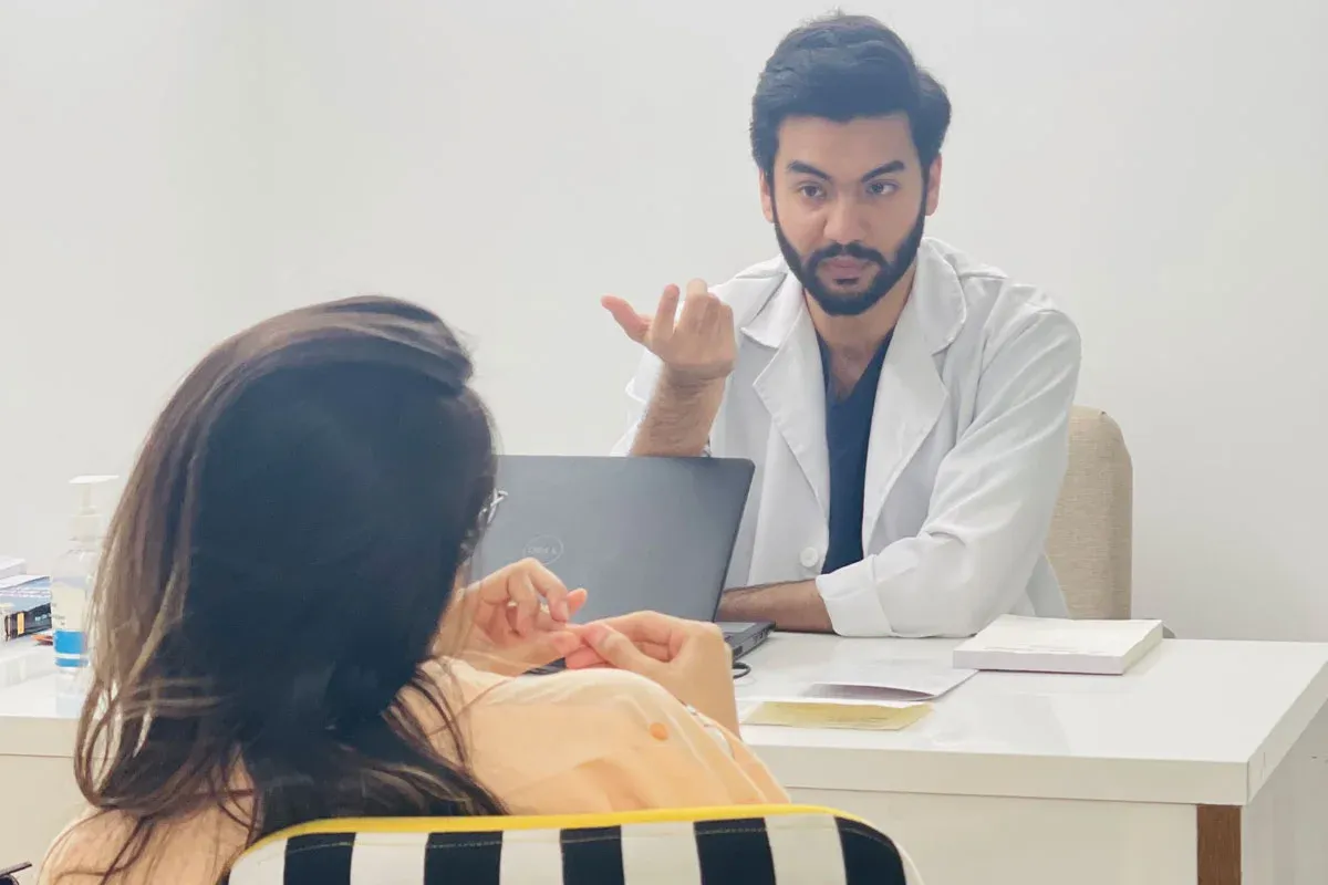 A dentist explaining a treatment plan during a consultation