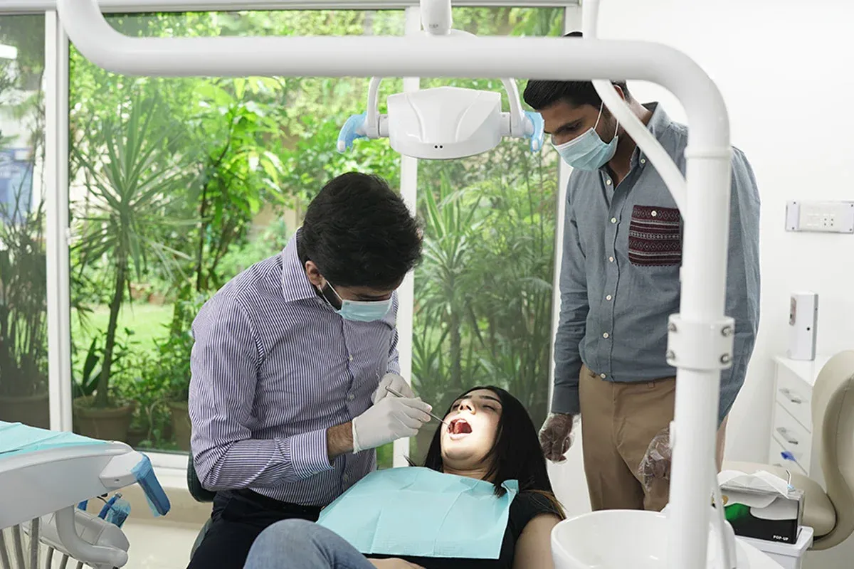 A dentist examining a patient's teeth