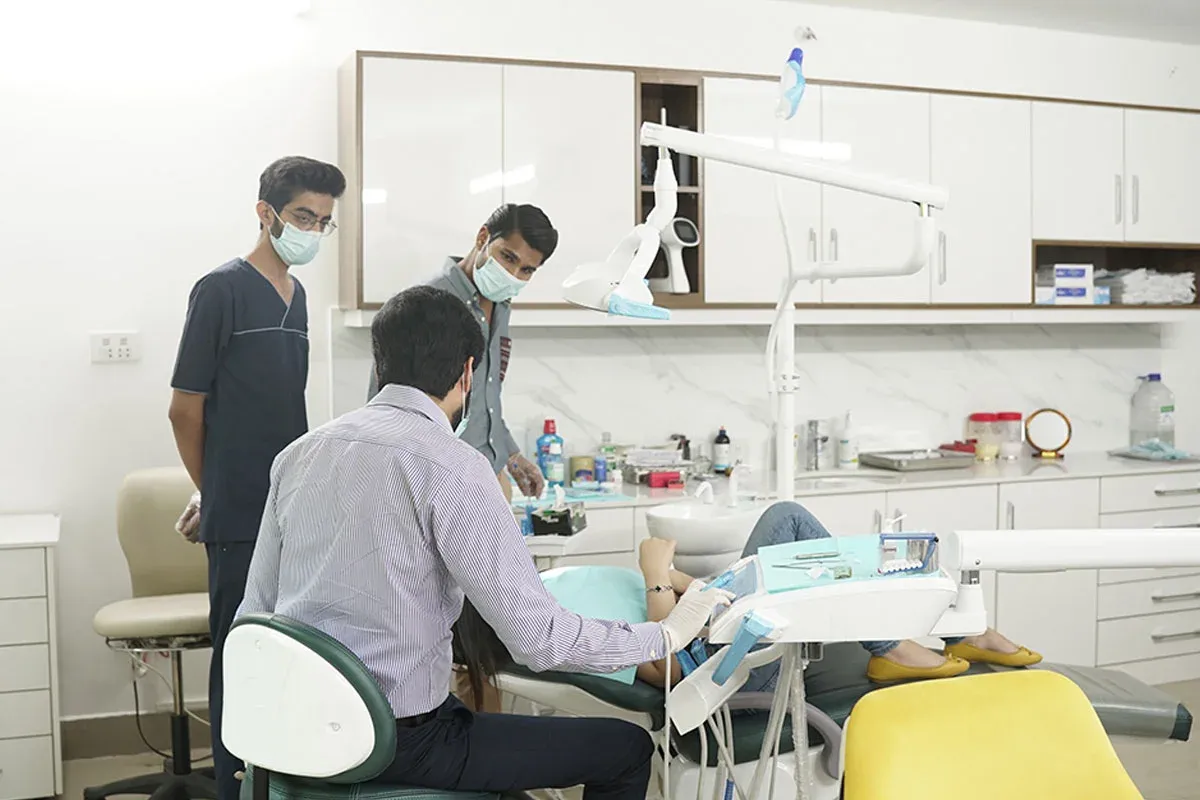 Dentists at work in a treatment room